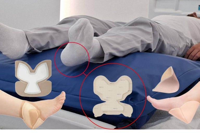 Heel suspended clear of the multiTURN 6 mattress surface beside a heel-specific soft silicone multilayer foam prophylactic dressing for pressure injury prevention